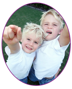 stock photo two young brothers pointing at camera